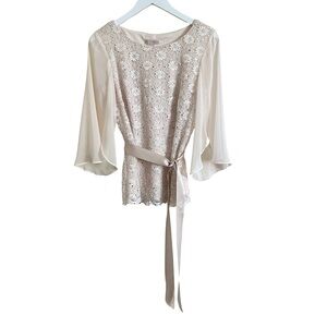 Cream dressy blouse belted sequins lace flowing sleeves.